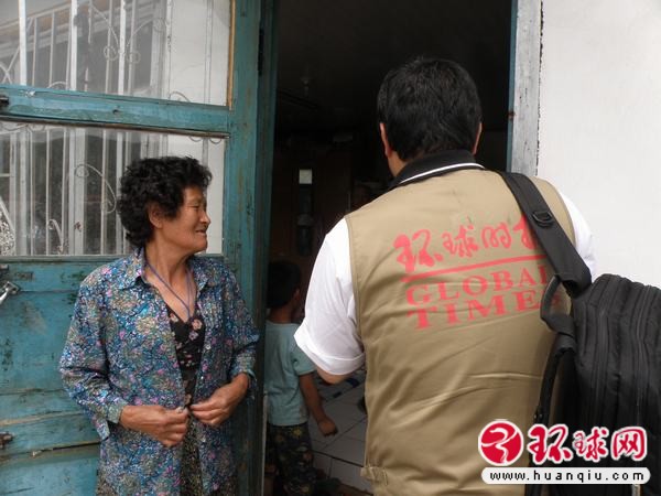 Huanqiu Reporter Chen Gang in Sanhezhen June 2011