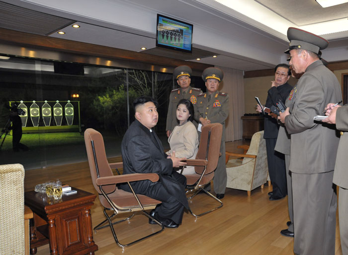 Kim Jong-un and Ri Sol-ju at a shooting range. Image via Rodong Sinmun