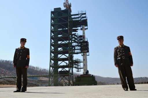 KPA Soldiers in front of the Unha-3 rocket at Tangachai-ri space centre in North Korea on April 8, 2012 (AFP/File, Pedro Ugarte)